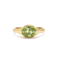 Oval Shape Prong Setting Peridot Ring in 14K Gold — view 1
