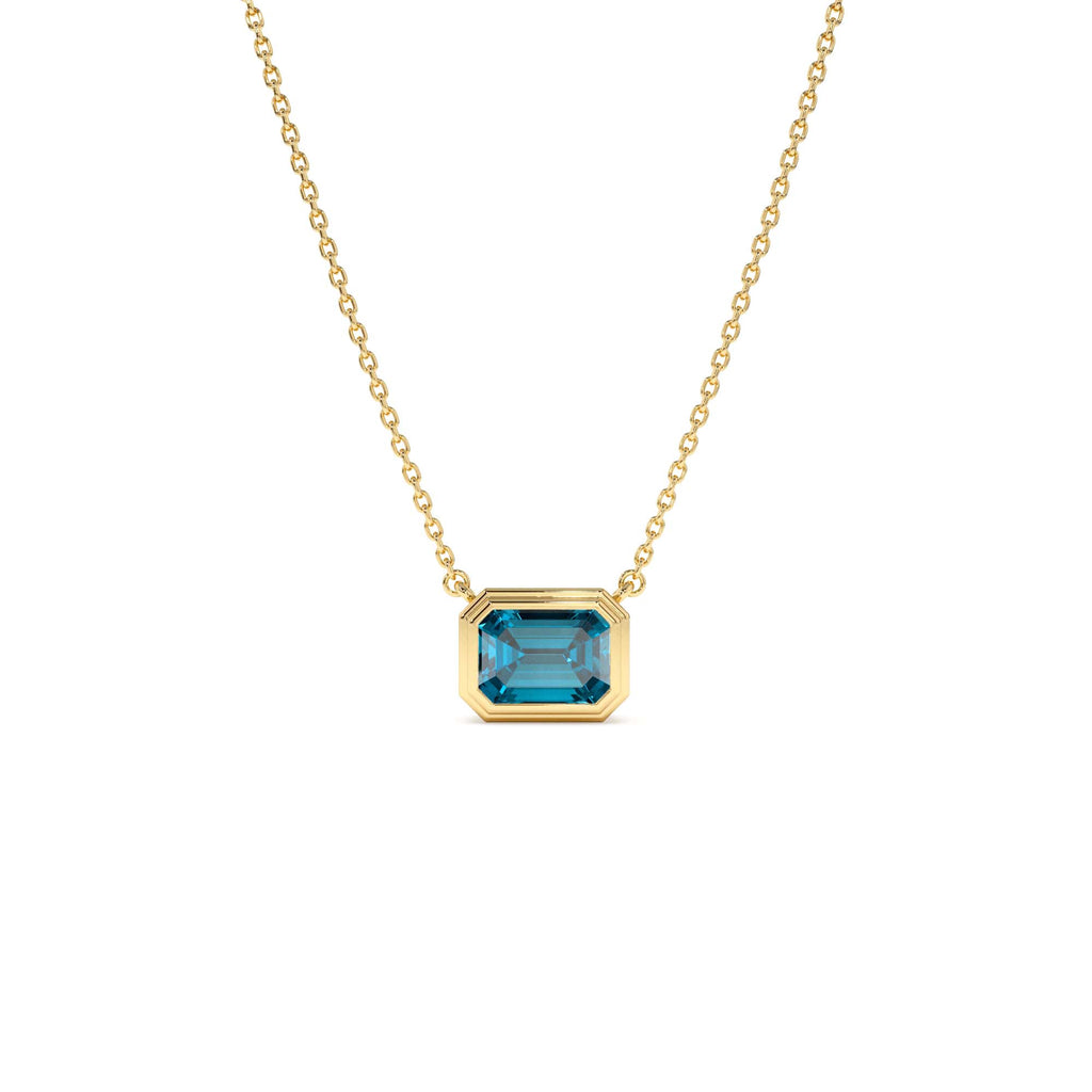 1.25 CTW Emerald Cut Bezel Setting Blue Topaz in 14K Gold — view 1
