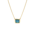 1.25 CTW Emerald Cut Bezel Setting Blue Topaz in 14K Gold — view 1