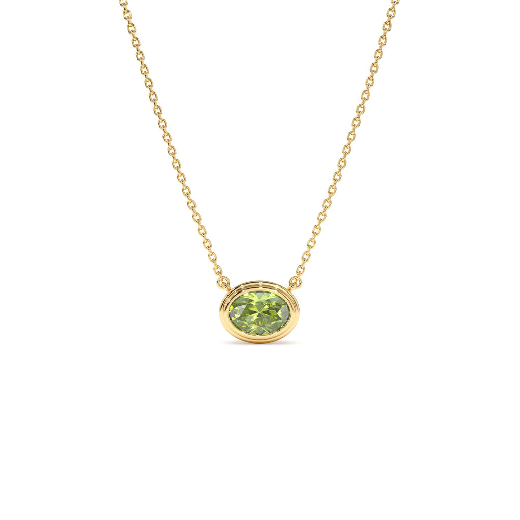 Oval Shape Bezel Set Peridot Necklace in 14K Gold — view 1