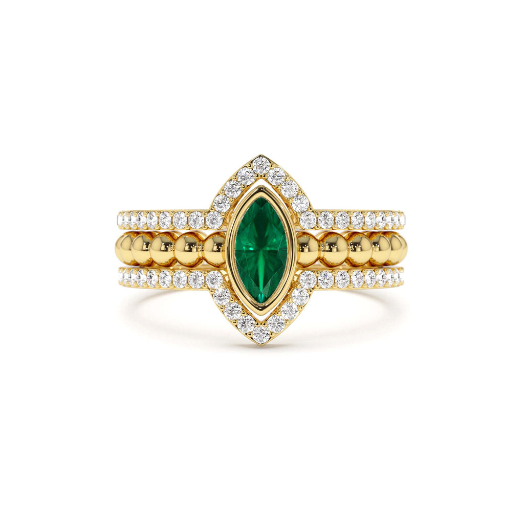 Marquise Shaped Emerald Ring with Nesting Diamond Bands in 14K Gold — view 1
