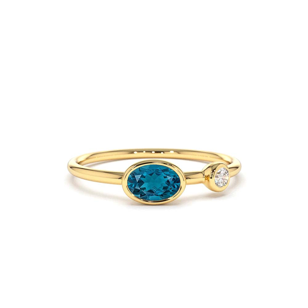 Oval London Blue Topaz and Diamond Ring in 14K Gold — view 1